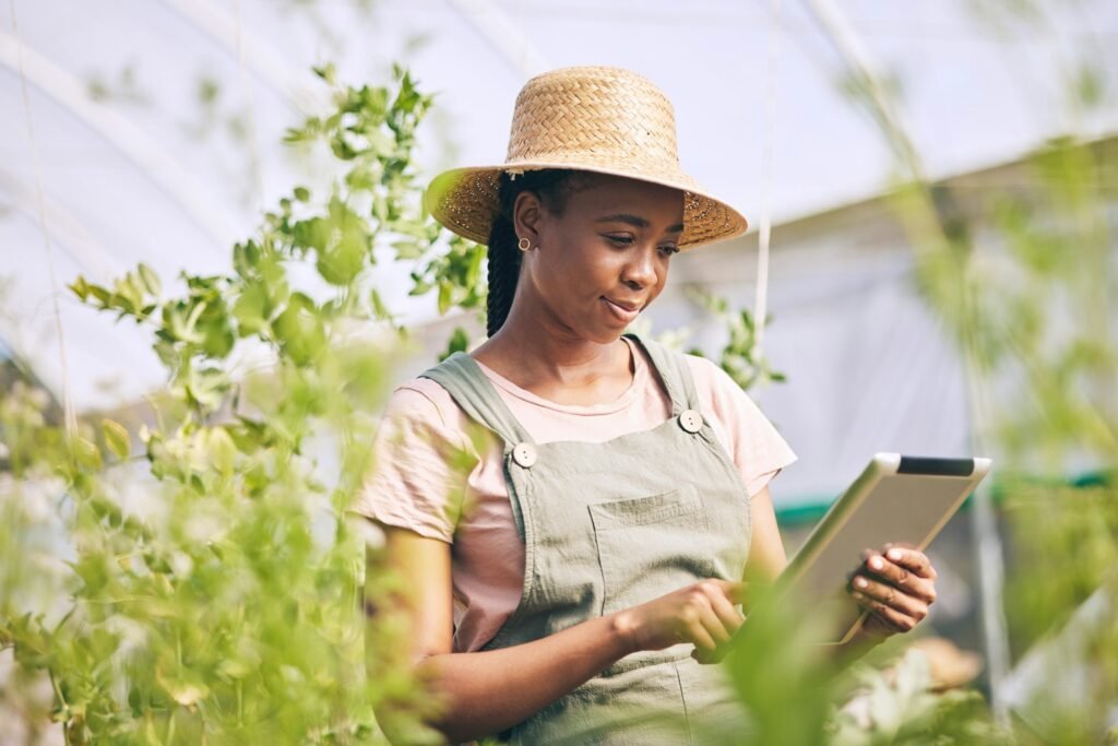 Gardening, research on tablet and black woman on farm checking internet website for information on
