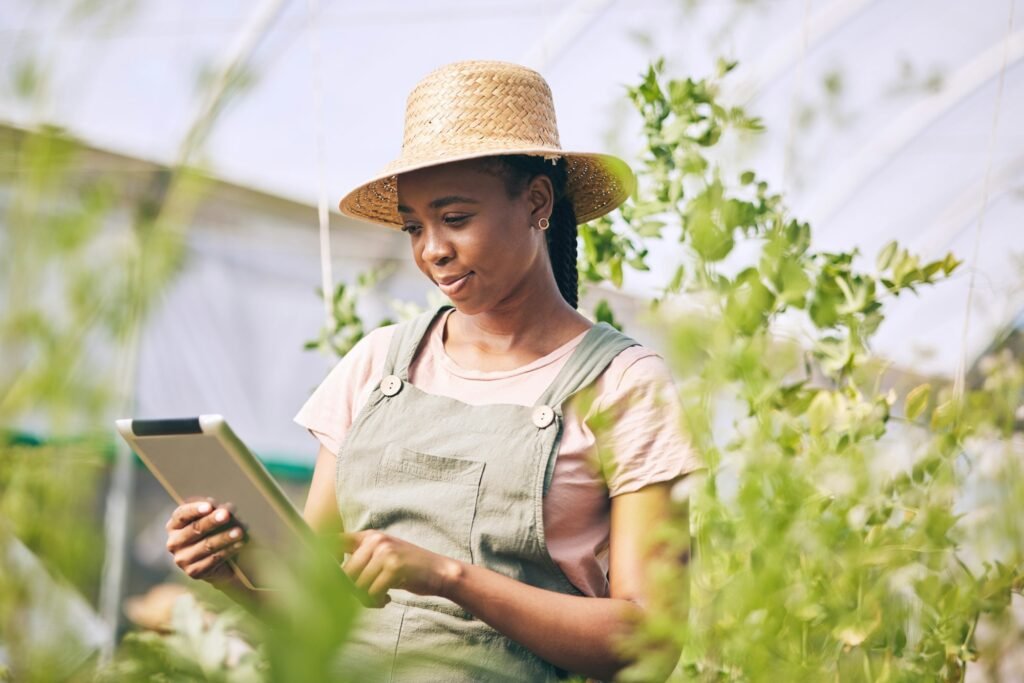 Gardening, research on tablet and black woman on farm checking internet website for information on
